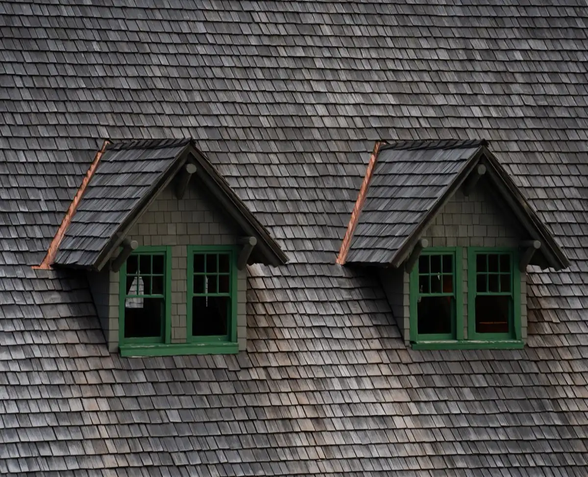 Dormers on a shingle roof in Taylor, MI, where step flashing and kickout flashing carry water past the walls